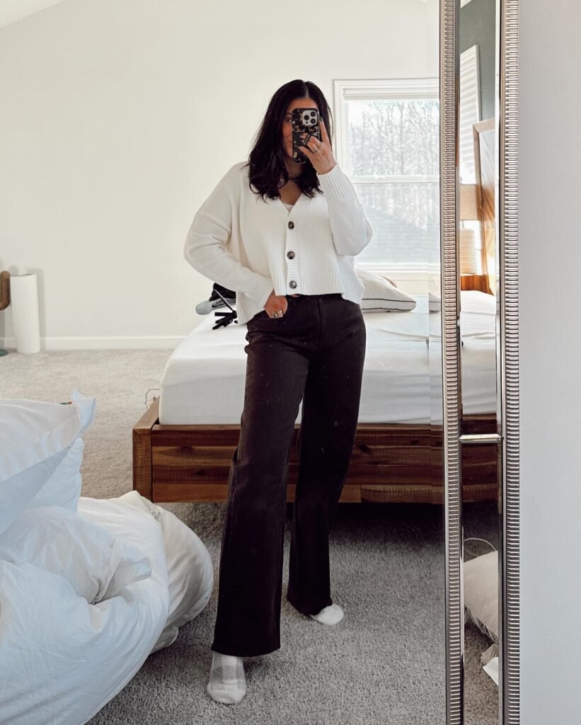 White Cardigan with Black Straight-Leg Jeans